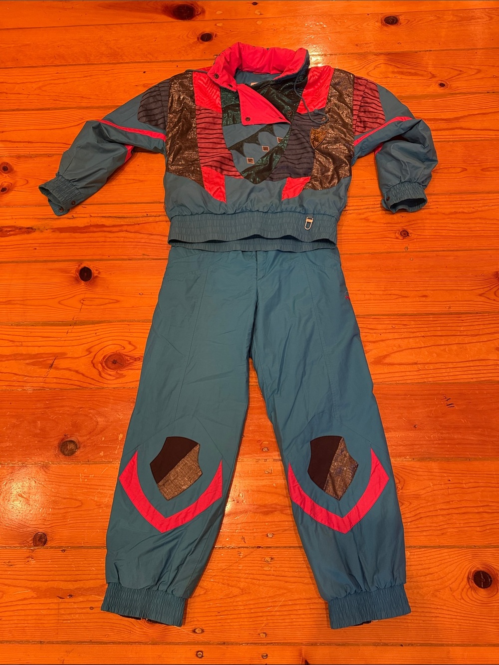Vintage Bogner Women’s size 8 Teal, metallic, and Pink embroidered Ski suit.